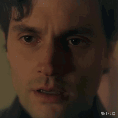 a close up of a man 's face with a netflix logo in the background .