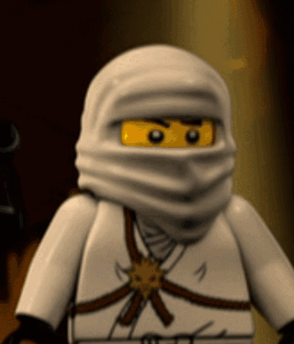 a close up of a lego ninjago character wearing a white hood
