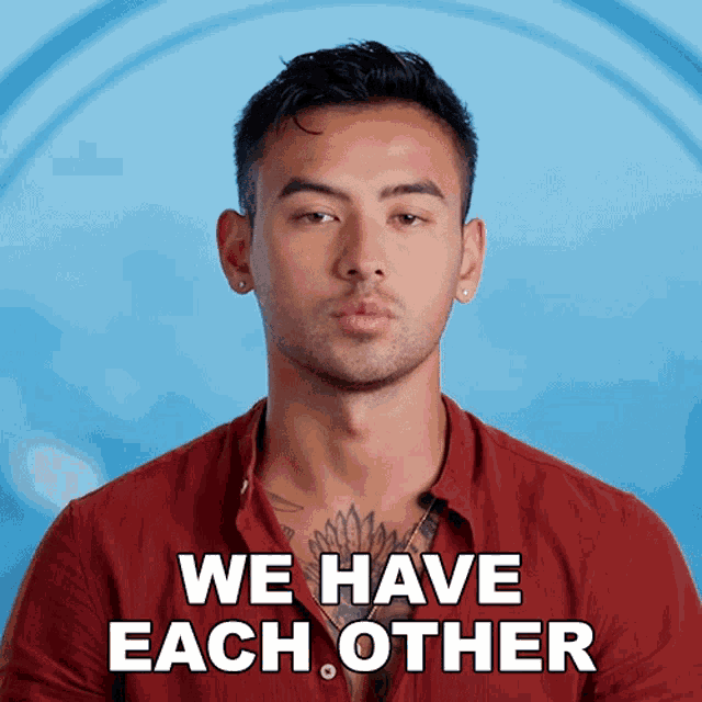 a man in a red shirt with the words we have each other