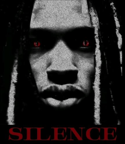 a black and white photo of a person 's face with red eyes and the word silence below it .