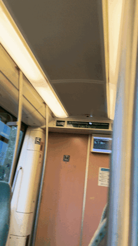 the inside of a train with a sign that says " emergency exit "