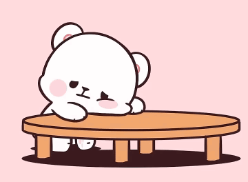A small white cartoon bear rests its head on a low table, looking bored.