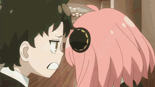 a boy and a girl are standing next to each other and the girl has pink hair
