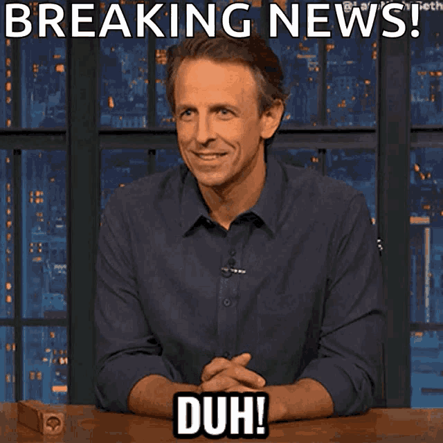 Seth Meyers sits at a desk beneath “BREAKING NEWS” and a “DUH!!” caption.