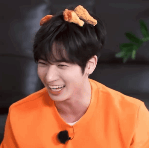 a young man with chicken nuggets on his head
