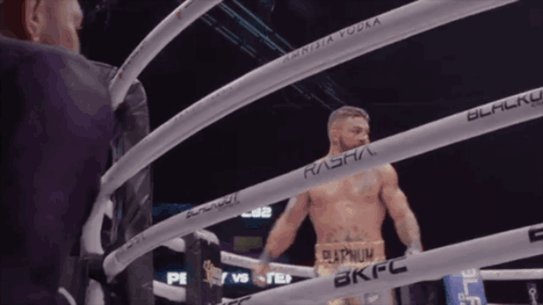 a man in a boxing ring with the word rasha on the ring ropes