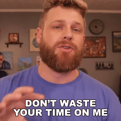 a man with a beard wearing a blue shirt says " don 't waste your time on me "