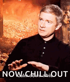 Martin Freeman gestures calmly in front of a fiery background, captioned “NOW...CHILL OUT.”