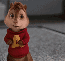 Alvin from Alvin and the Chipmunks stands wide-eyed in a red hoodie.
