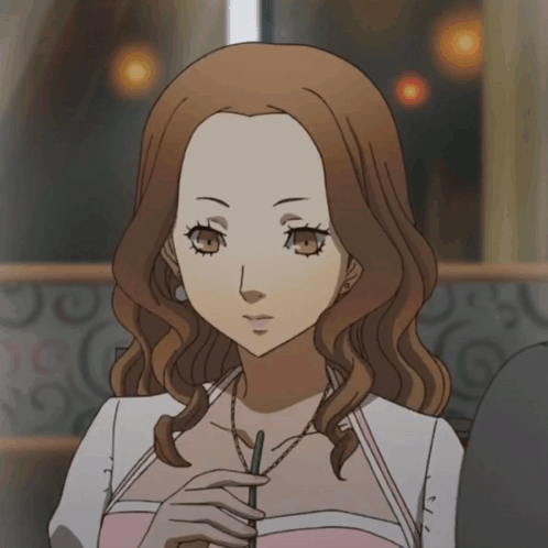 a woman with brown hair is holding a straw
