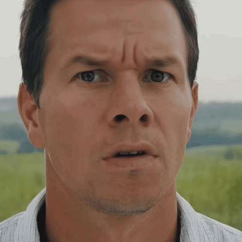 a close up of a man 's face making a funny face