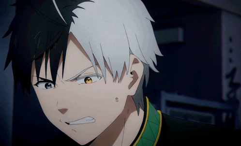 Blushing black-and-white-haired anime boy grimaces in embarrassment.