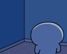 A small blue cartoon figure faces a corner as if hiding sadly.