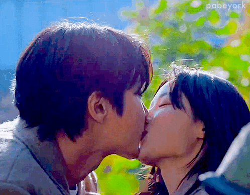 a close up of a man and woman kissing with the word pabyork visible in the upper right corner