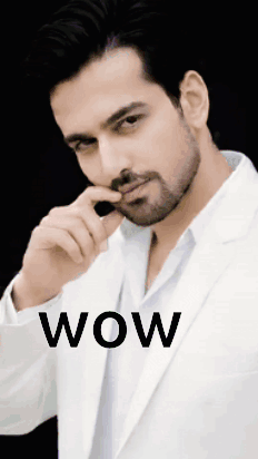 A man in a white shirt poses with his hand near his face under “WOW.”