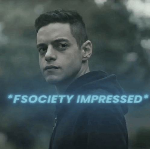 a man in a black hoodie is standing in front of a sign that says " fsociety impressed "