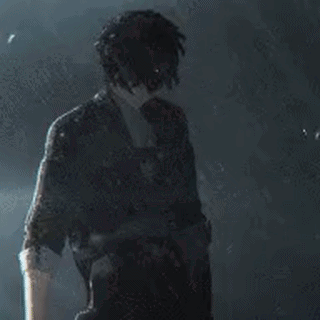 a man in a suit and tie is standing in the dark holding a gun .