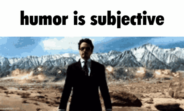 a man in a suit and tie stands in front of a mountain range with the words humor is subjective above him