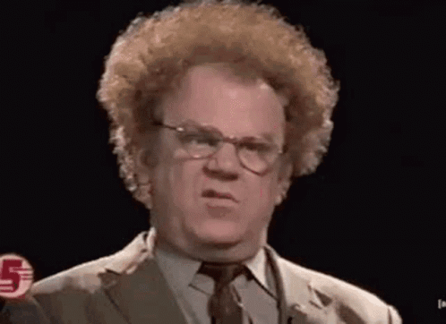 A man with curly hair gives a confused, skeptical look.