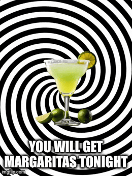 a margarita in a glass with limes on a black and white swirl background .
