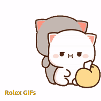 a couple of cats are sitting next to each other and one of them is holding an apple