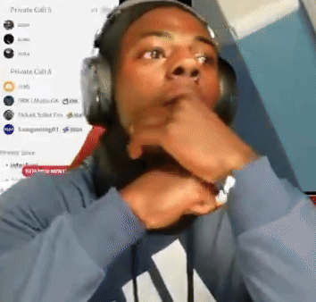 IShowSpeed points toward his mouth in astonished disbelief.