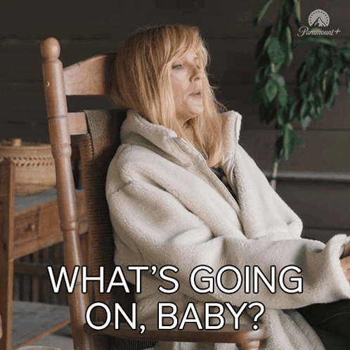 a woman is sitting in a rocking chair with the words what 's going on baby