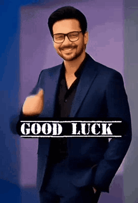 A stylized man in glasses gives a thumbs-up above a “GOOD LUCK” banner.