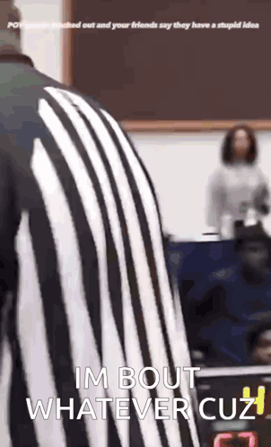 Person in striped clothing moves through a room with “I’m bout whatever cuz” text.
