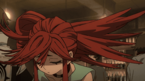 a girl with red hair is smiling with her eyes closed and her hair is blowing in the wind