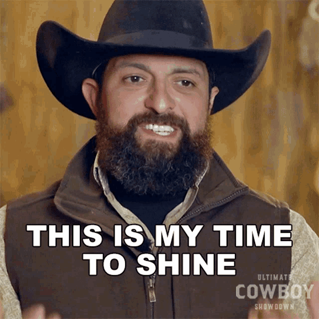a man with a beard wearing a cowboy hat and vest says this is my time to shine