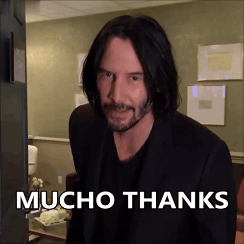 Keanu Reeves as John Wick says “MUCHO THANKS” in bold white text.