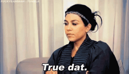a woman is sitting on a couch and saying true dat