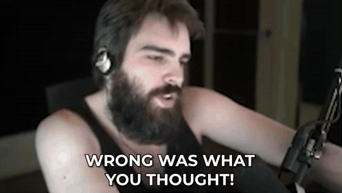 a man with a beard and headphones is talking into a microphone and says wrong was what you thought .