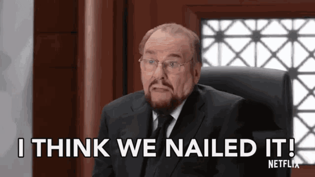 a man in a suit and tie is sitting in a chair and saying i think we nailed it !