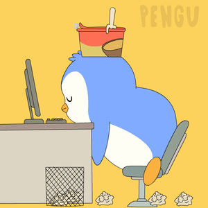 A blue penguin slumps asleep at an office desk.