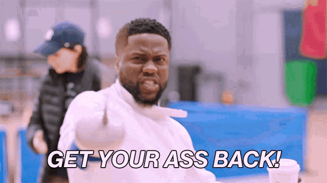 a man pointing at the camera with the words get your ass back written below him