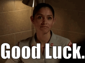 a woman is smiling and says good luck