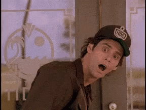 A man in a cap leans back with an astonished expression.