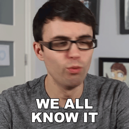 a man wearing glasses and a grey shirt says we all know it