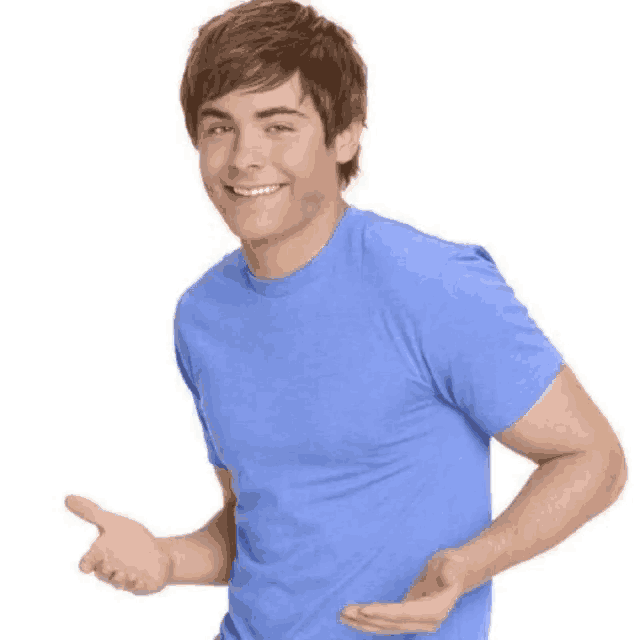 A young man in a blue T-shirt holds his hands out in a friendly shrug.