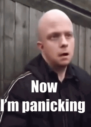 A bald man stares ahead in alarm beneath the caption “Now I’m panicking.”