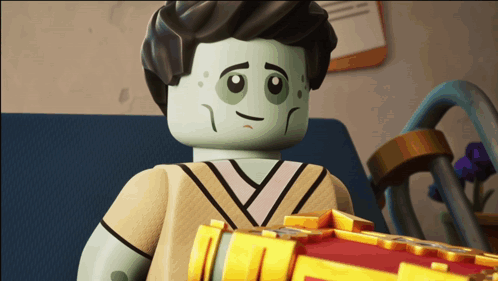a lego figure with a sad look on his face is holding a book
