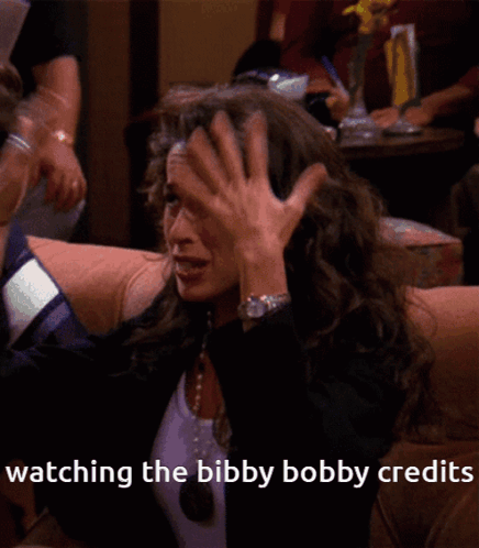 a woman sitting on a couch with the words watching the bibby bobby credits on the bottom