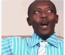 A man in a striped shirt rolls his eyes with an open-mouthed rude reaction.