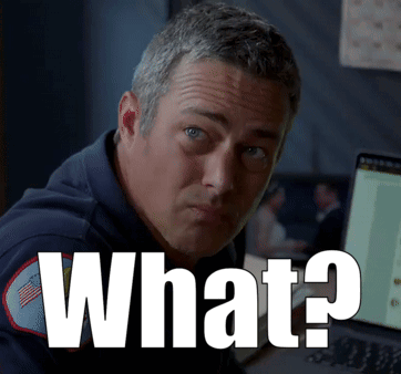 a man sitting in front of a computer with the words what written on the screen