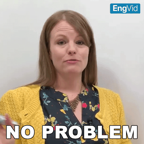 a woman wearing a yellow cardigan says no problem