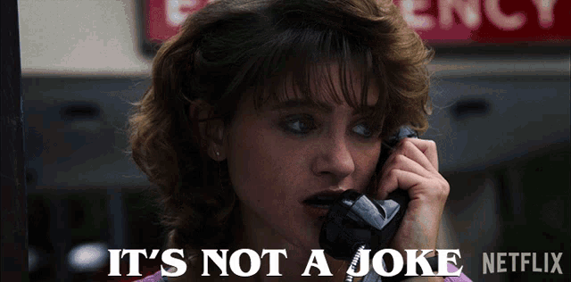a woman talking on a phone with the words " it 's not a joke netflix " above her