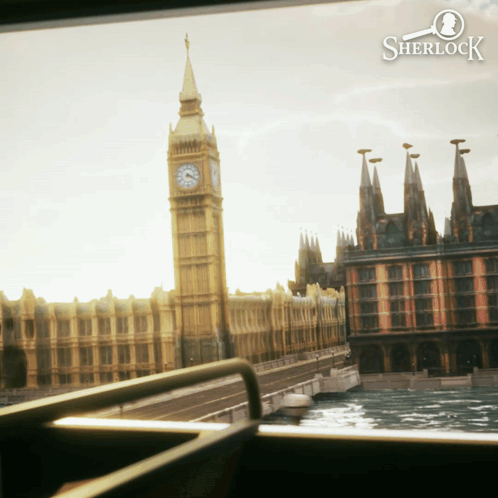a clock tower with a sherlock logo on it