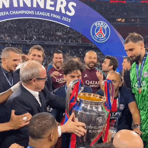 a group of men holding a trophy in front of a paris sign